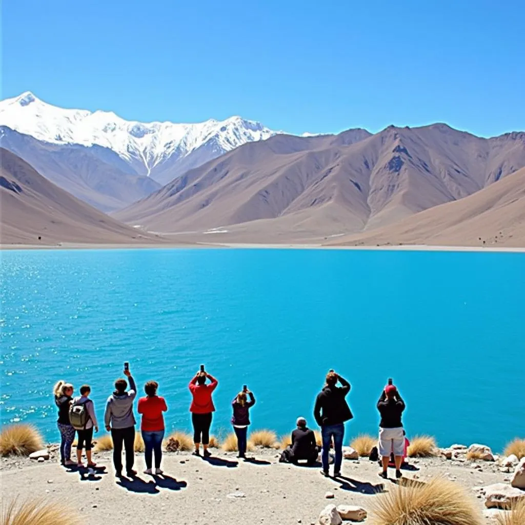 Tourists taking photos at Pangong Tso Lake