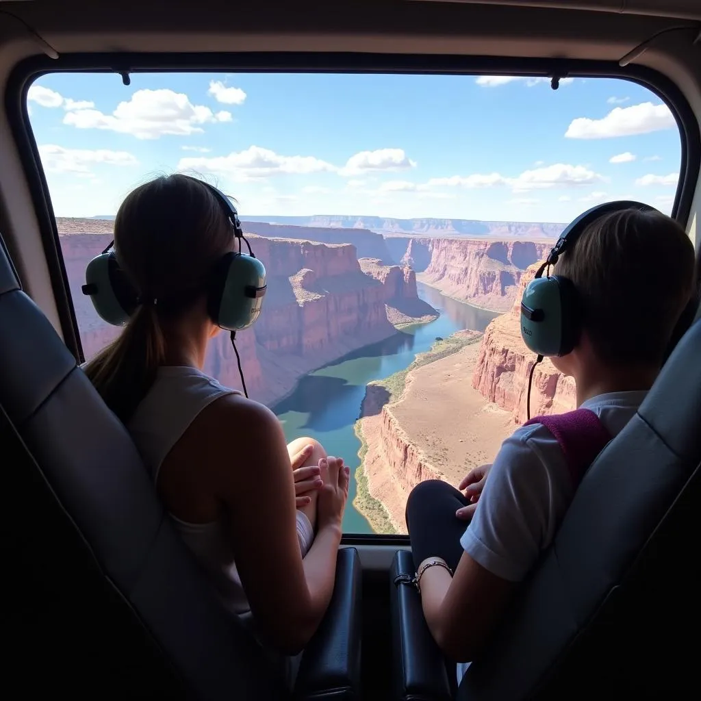 Passengers looking out of helicopter window at the Grand Canyon