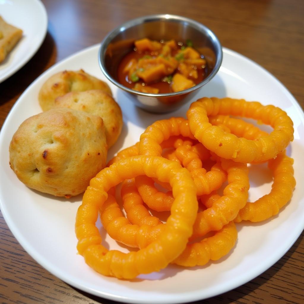 A plate of Bedai and Jalebi, a traditional Agra breakfast.