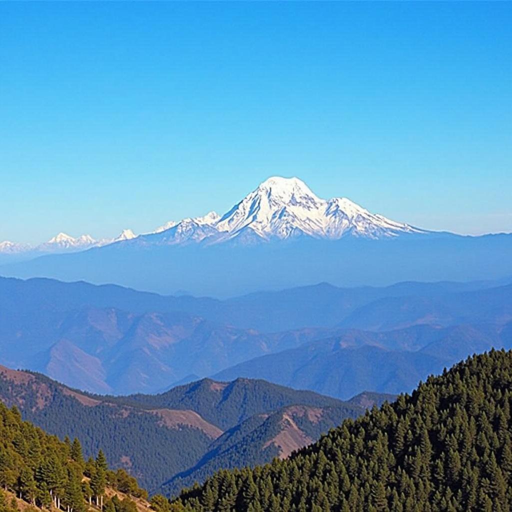 Breathtaking view of the Kanchenjunga mountain range from a viewpoint accessible through Sikkim tour packages from Ahmedabad.