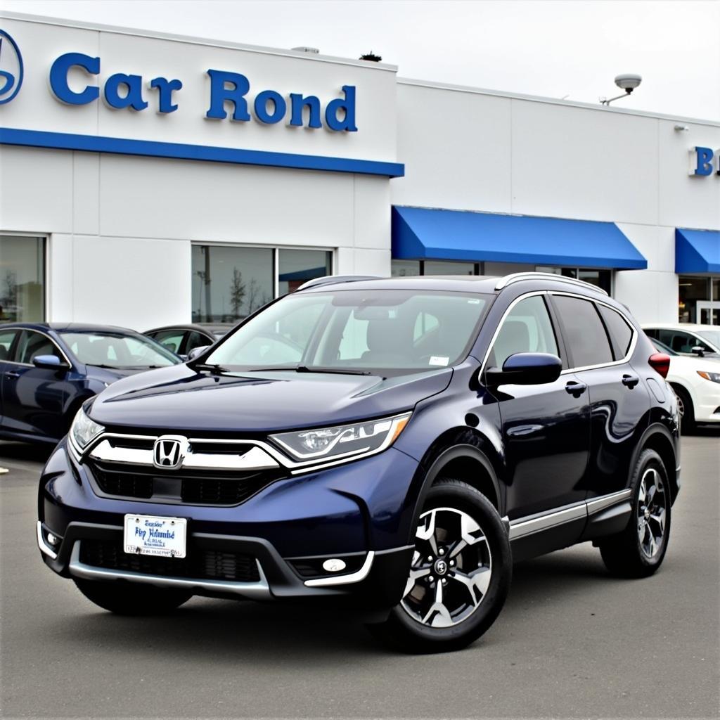 2017 Honda CR-V Touring in Obsidian Blue Pearl at a Dealership